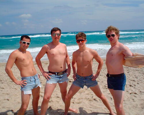 Some pasty white guys sporting jorts on the beach