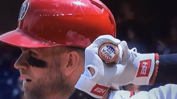 Bryce Harper awaiting the pitch with the MBFA sticker at the end of his bat