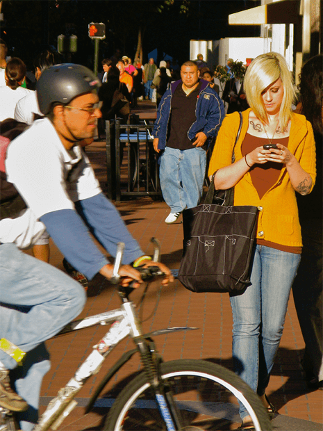 A woman texting while walking