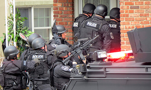 A SWAT team responding to a fake emergency