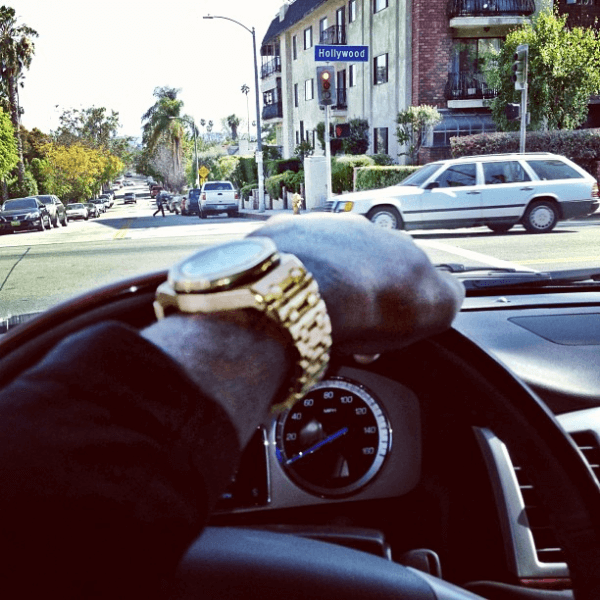 A man driving his whip with his bling