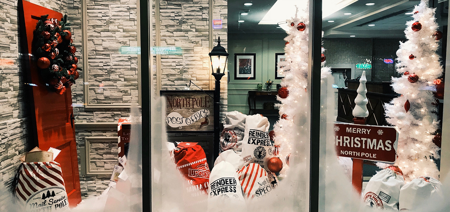 A window decorated for Christmas
